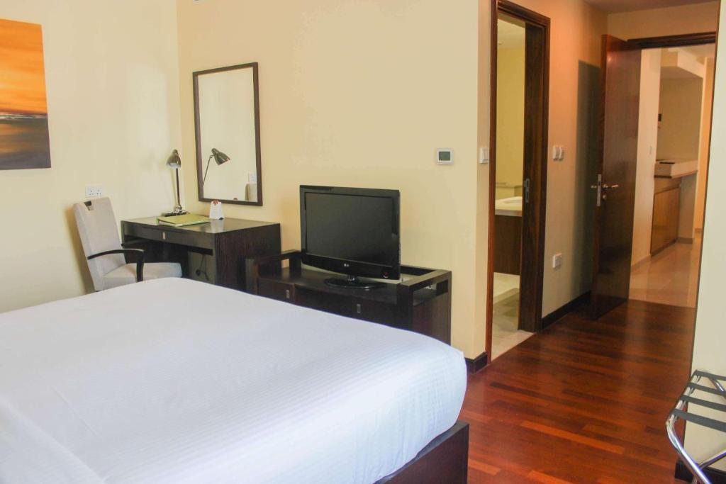 Postel nebo postele na pokoji v ubytování Ramada by Wyndham Downtown Dubai