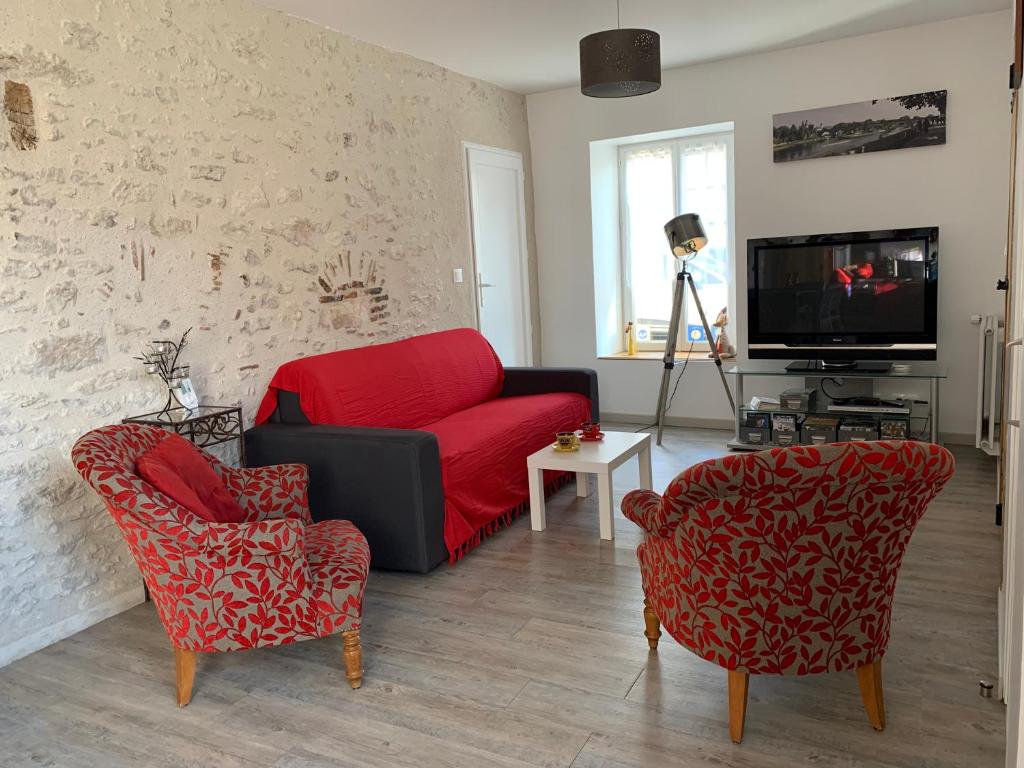 TV a/nebo společenská místnost v ubytování Gîte du Parc des Mauves