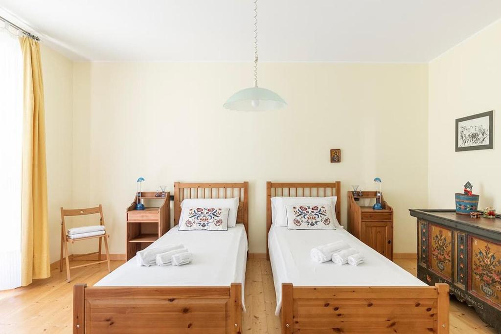 Łóżko lub łóżka w pokoju w obiekcie Villa Elisabeth