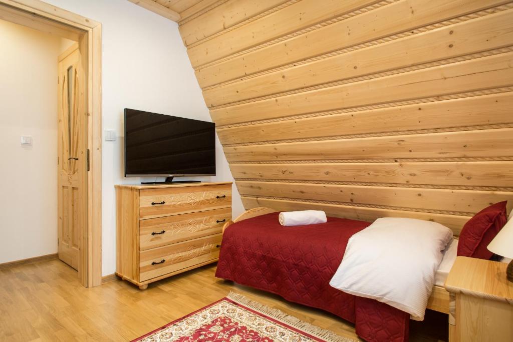 Televízia a/alebo spoločenská miestnosť v ubytovaní ApartHost Tatra Panorama