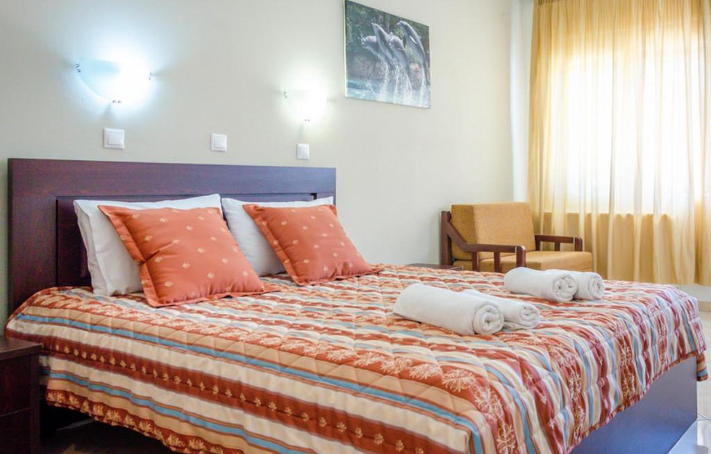 Postel nebo postele na pokoji v ubytování Delfini Hotel