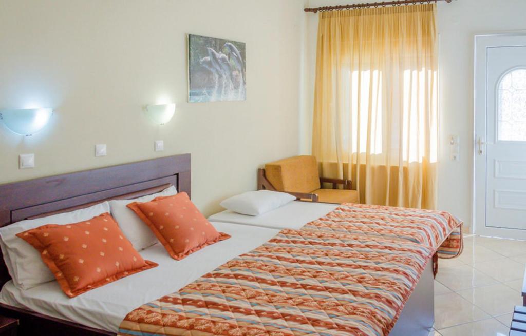 Postel nebo postele na pokoji v ubytování Delfini Hotel