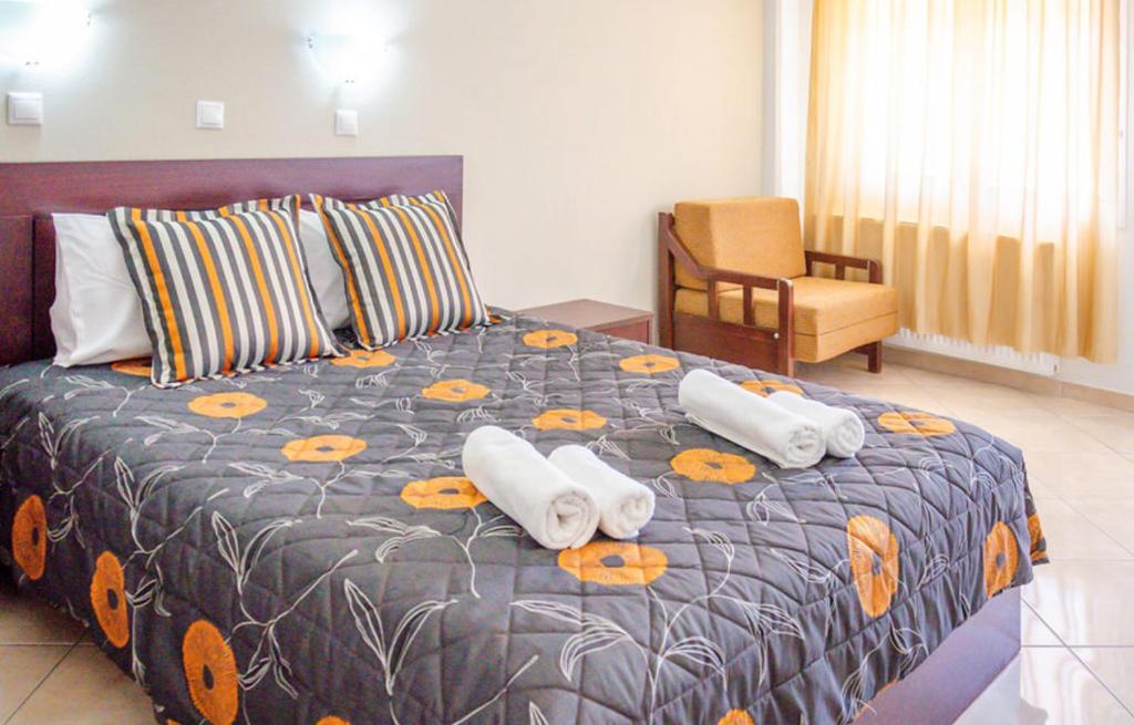 Postel nebo postele na pokoji v ubytování Delfini Hotel
