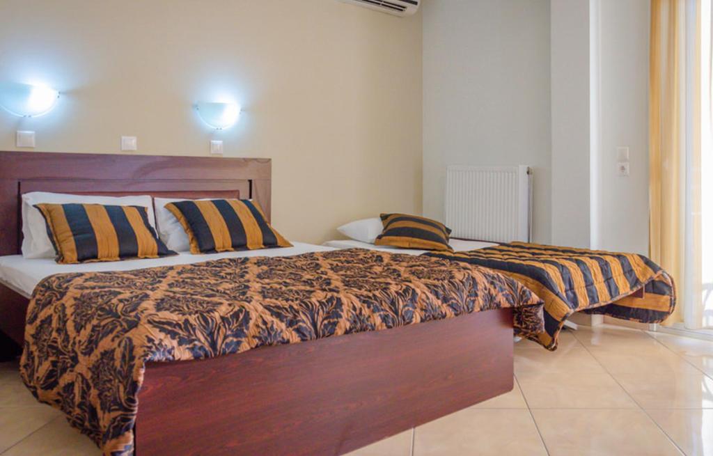 Postel nebo postele na pokoji v ubytování Delfini Hotel