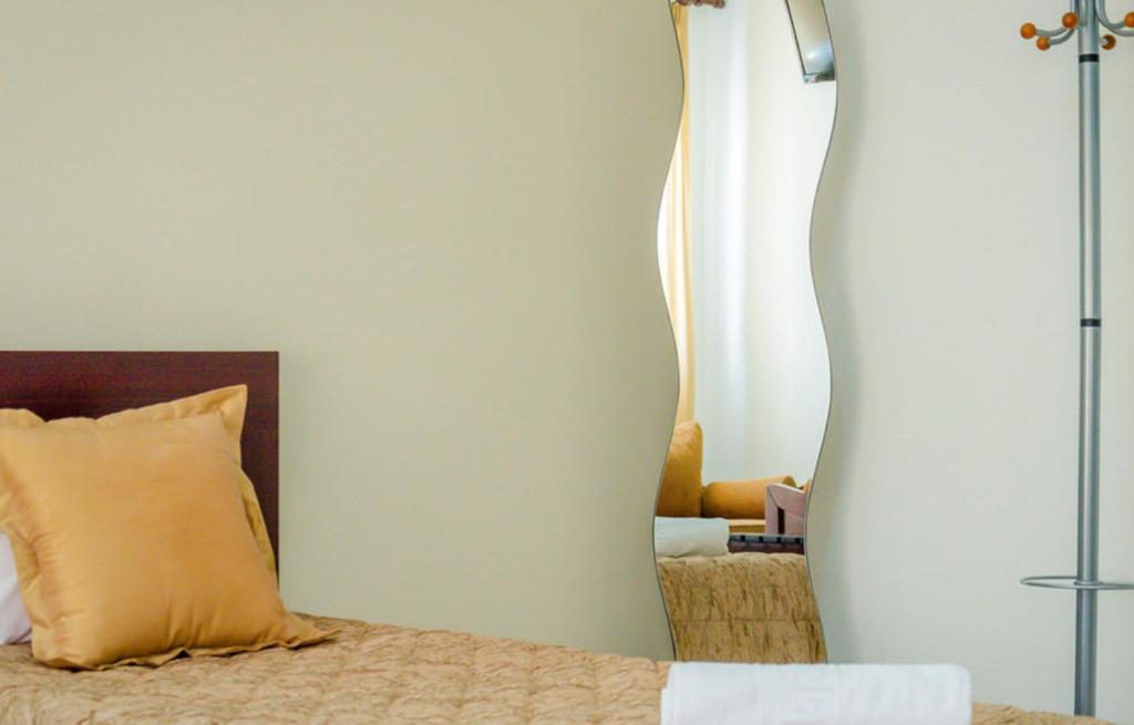 Postel nebo postele na pokoji v ubytování Delfini Hotel