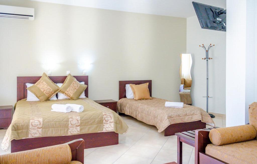 Postel nebo postele na pokoji v ubytování Delfini Hotel
