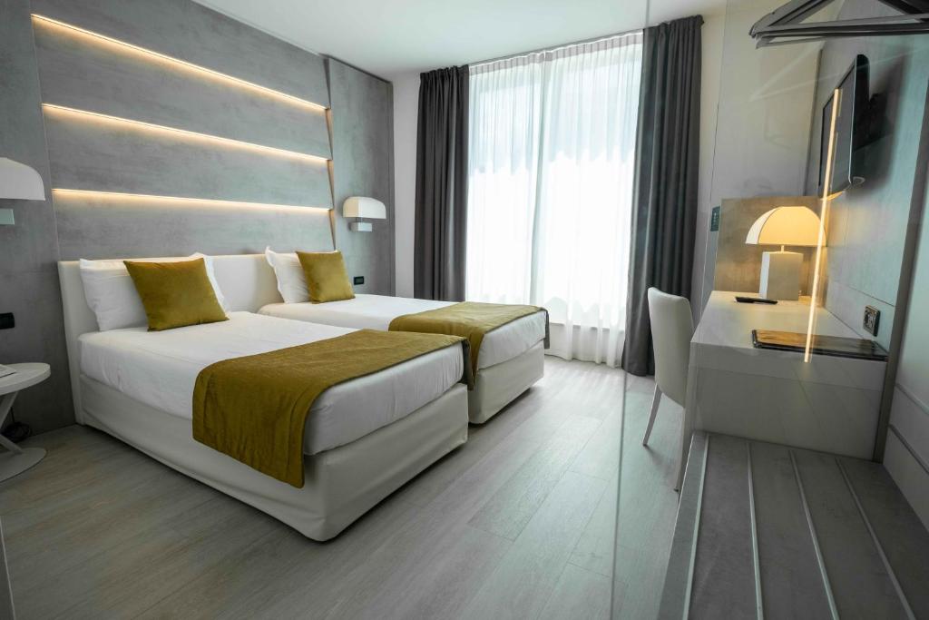 Postel nebo postele na pokoji v ubytování La Pieve Hotel
