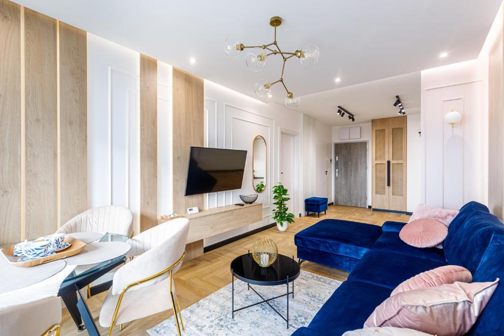 Televízia a/alebo spoločenská miestnosť v ubytovaní Balticus Apartamenty Deluxe Promenada Gwiazd 14