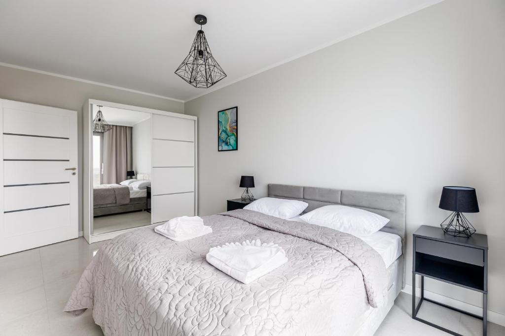 Posteľ alebo postele v izbe v ubytovaní Balticus Apartamenty Deluxe Promenada Gwiazd 14
