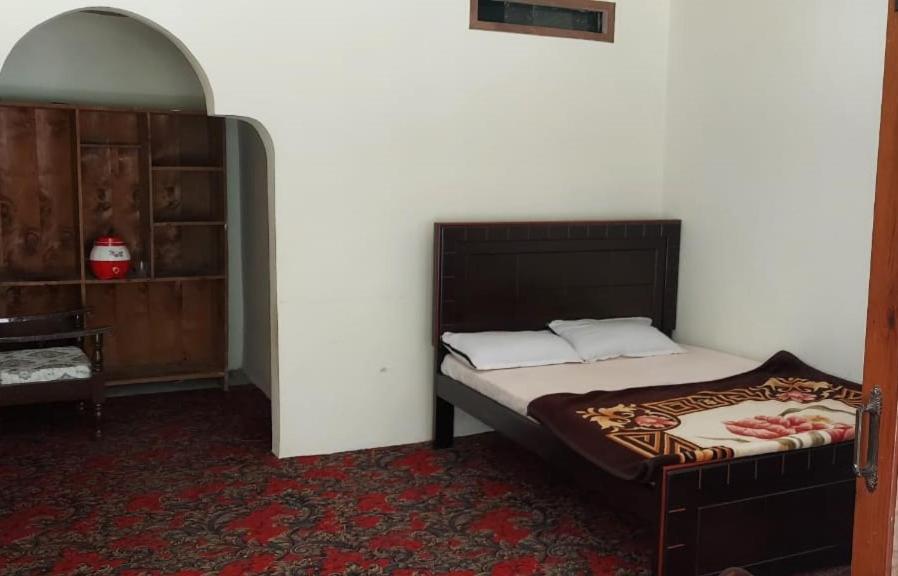 A bed or beds in a room at Welcome Guest House