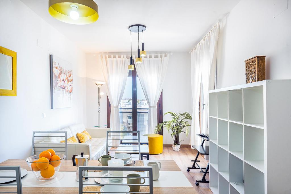 a living room with a couch and a table at Apartamento Entrenúcleos in Dos Hermanas