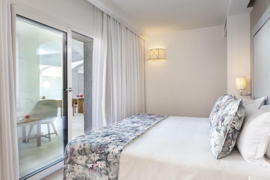 Posteľ alebo postele v izbe v ubytovaní Grand Hotel Cannigione
