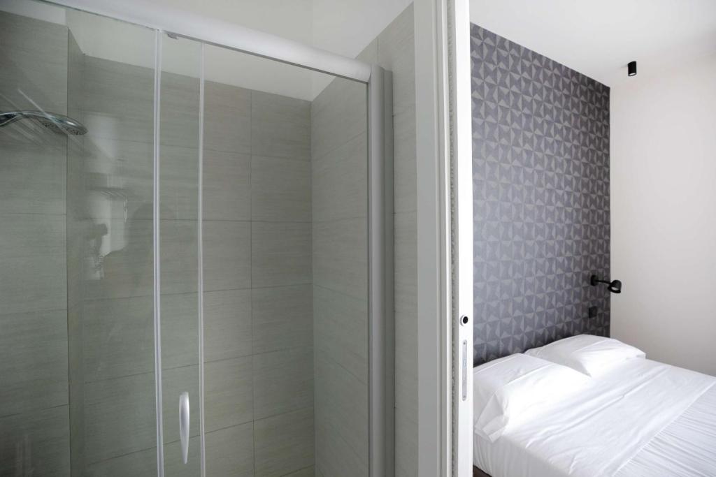Postel nebo postele na pokoji v ubytování Hotel Benvenuto