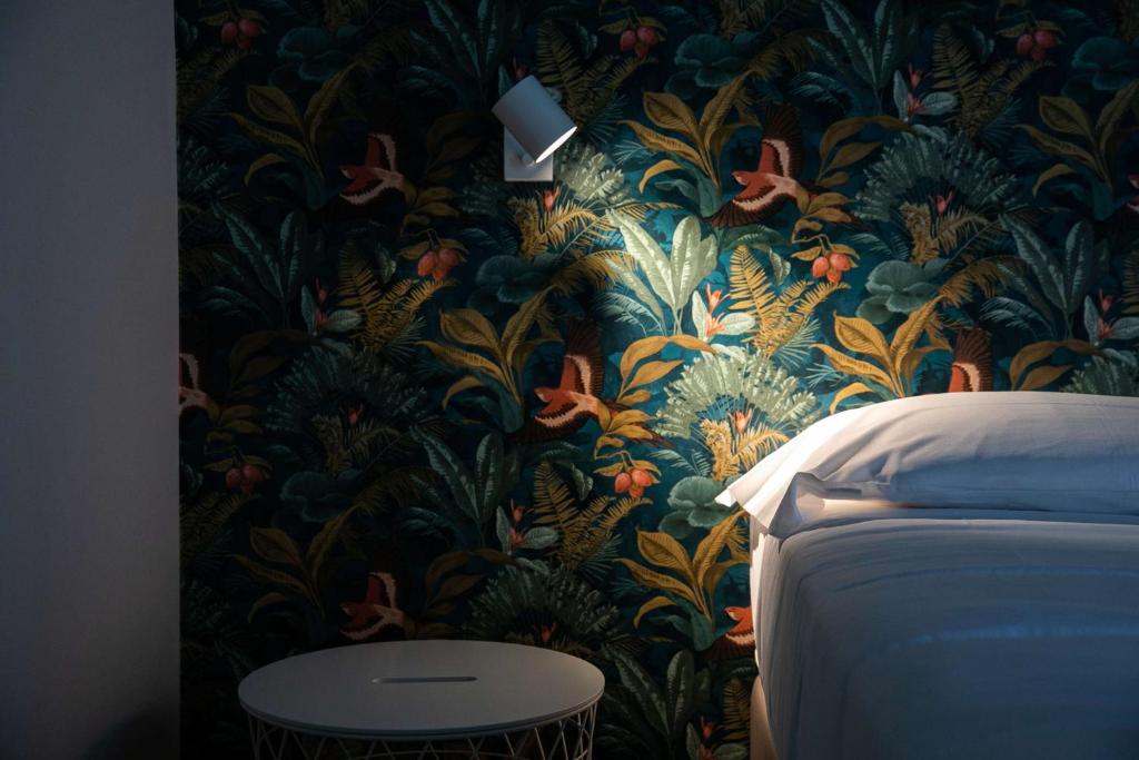 Postel nebo postele na pokoji v ubytování Hotel Benvenuto