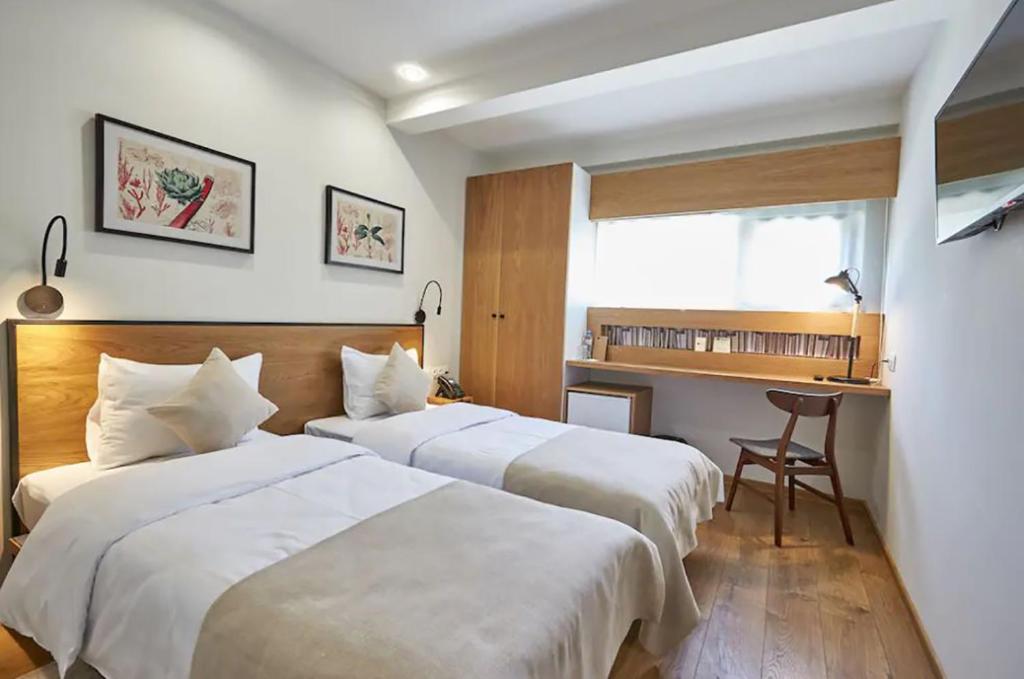 Postel nebo postele na pokoji v ubytování Urban Park Hotels