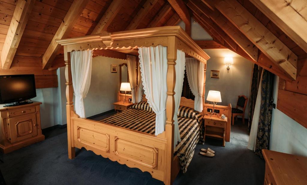Postel nebo postele na pokoji v ubytování Hotel Primiero
