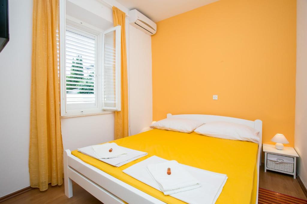Posteľ alebo postele v izbe v ubytovaní Yellow Room Guesthouse
