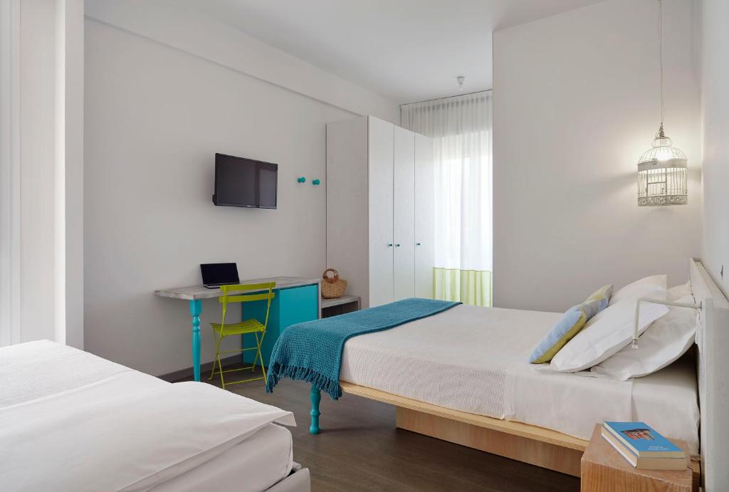 Postel nebo postele na pokoji v ubytování Hotel Madison