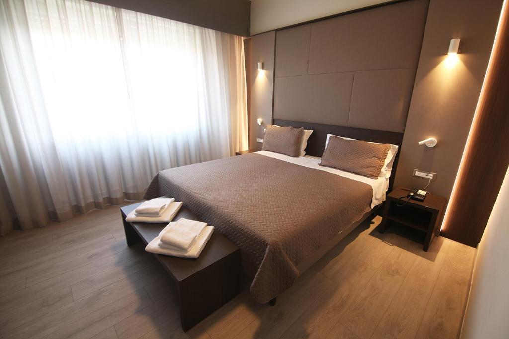 Postel nebo postele na pokoji v ubytování Hotel Santin