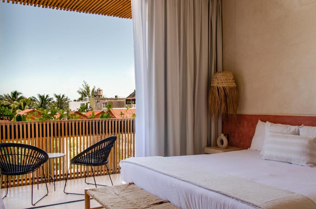 Postel nebo postele na pokoji v ubytování Casa Peregrino Holbox