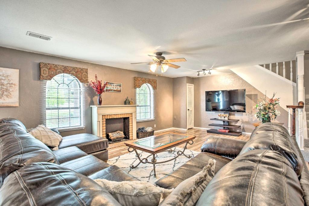 a living room with a couch and a table at Gainesville Home with Outdoor Oasis, 16 Mi to Lake in Gainesville
