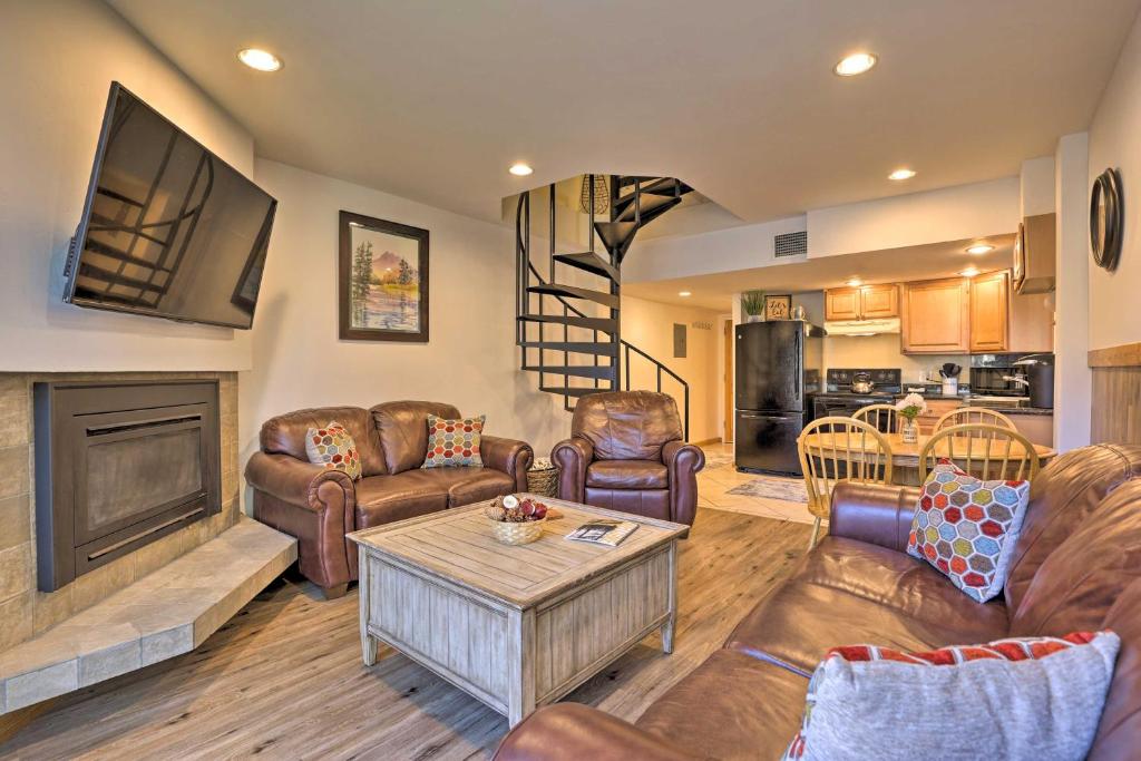 a living room with couches and a table at Copper Mountain Condo Near Ski Lift and Golf Course! in Copper Mountain