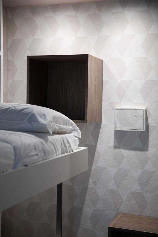 Postel nebo postele na pokoji v ubytování Hotel Benvenuto
