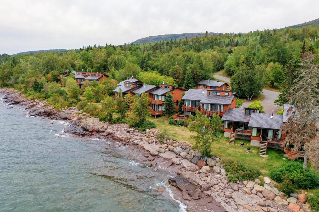 an aerial view of a home next to a river at Lutsen Sea Villas in Lutsen