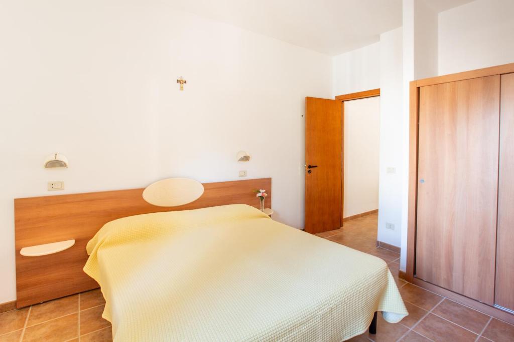 Łóżko lub łóżka w pokoju w obiekcie Villaggio Camping Oasi
