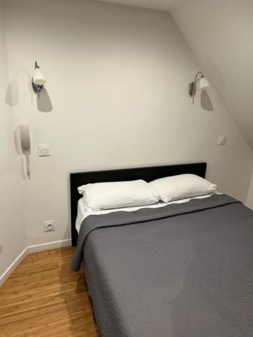 Un ou plusieurs lits dans un hébergement de l'établissement Hotel Luna Park