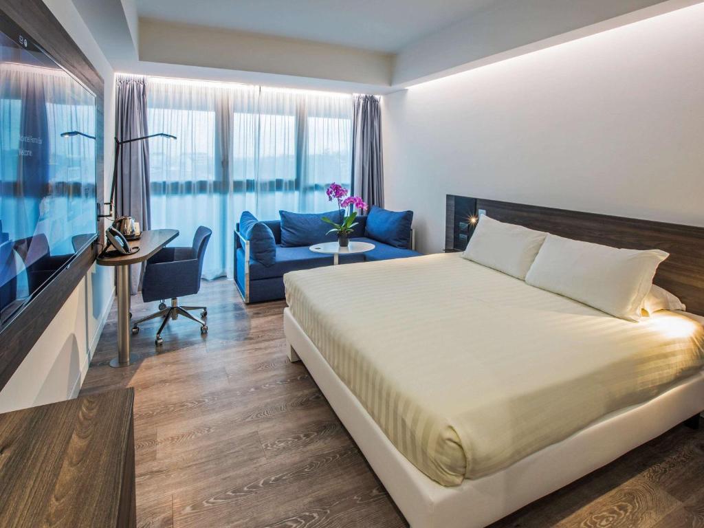 Postel nebo postele na pokoji v ubytování Novotel Roma Eur
