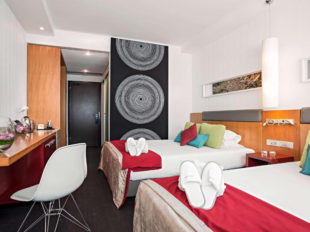 Postel nebo postele na pokoji v ubytování Novotel Roma Eur
