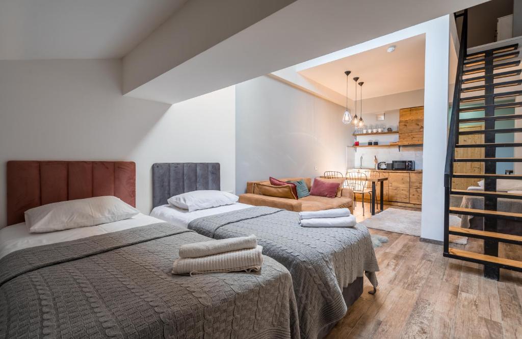 Postel nebo postele na pokoji v ubytování New Gudauri NG Rooms