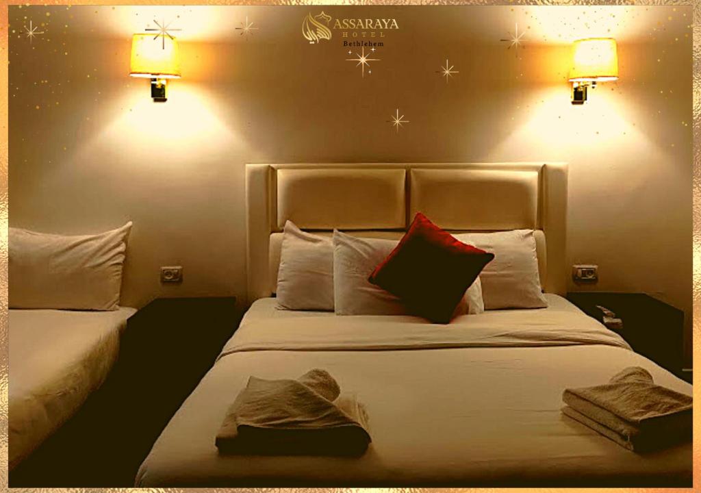 Postel nebo postele na pokoji v ubytování Assaraya Palace Hotel