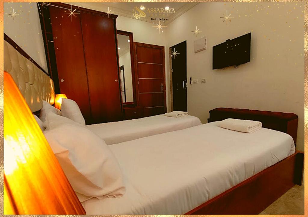 Postel nebo postele na pokoji v ubytování Assaraya Palace Hotel
