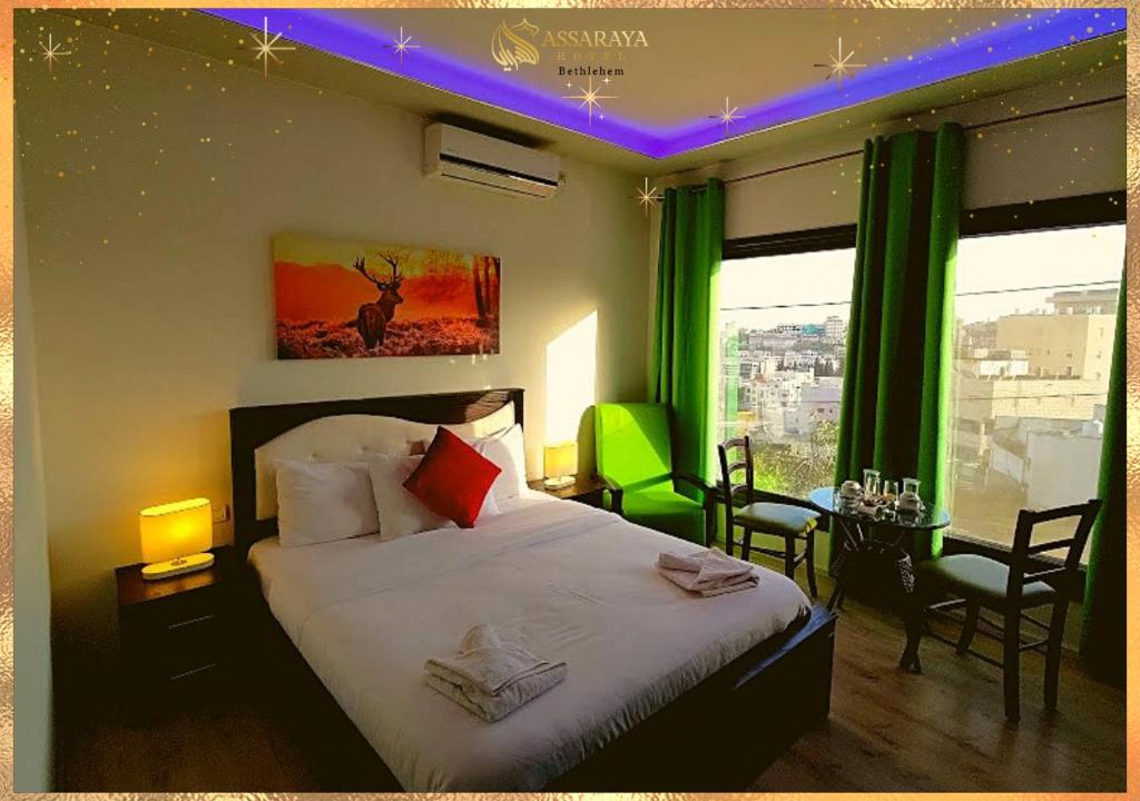 Postel nebo postele na pokoji v ubytování Assaraya Palace Hotel