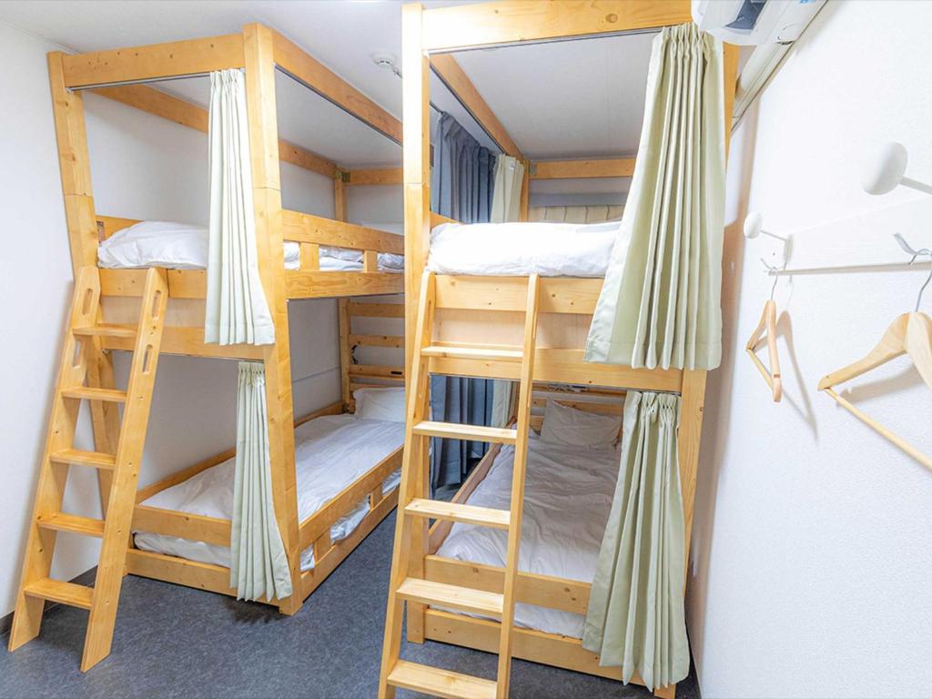 a couple of bunk beds in a room at Guest House Goto Times - Vacation STAY 59209v in Goto