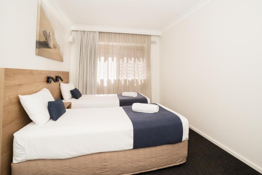 Postel nebo postele na pokoji v ubytování Caribbean Motel
