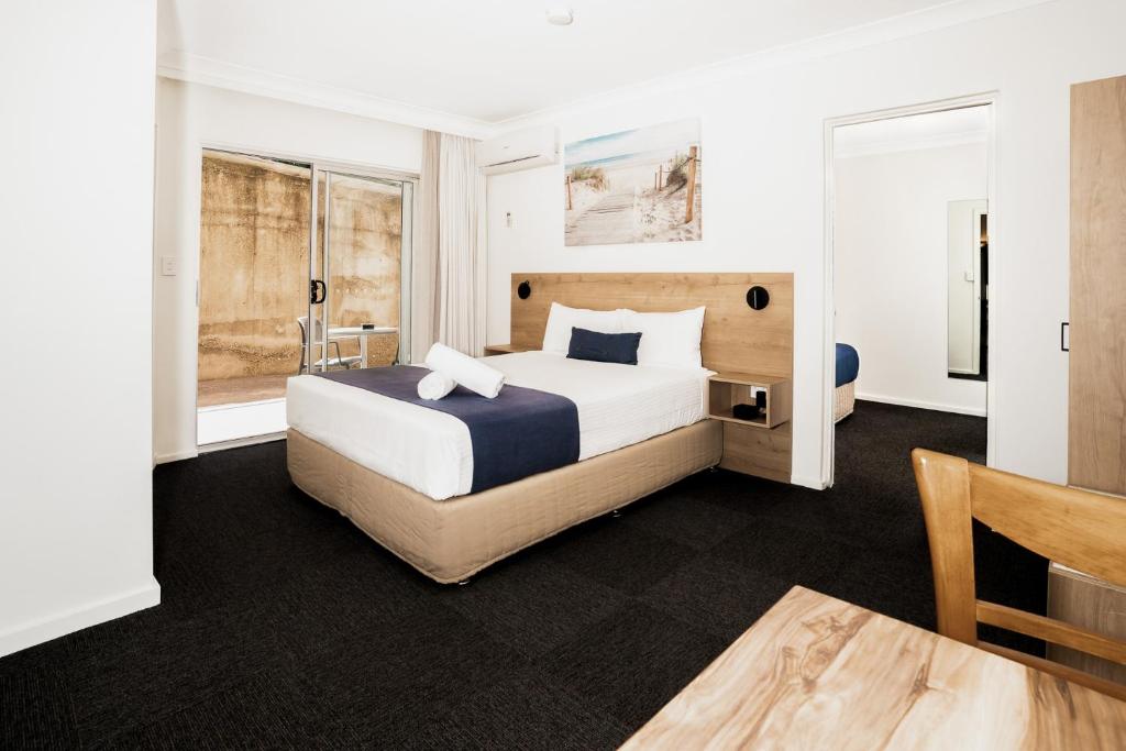 Postel nebo postele na pokoji v ubytování Caribbean Motel