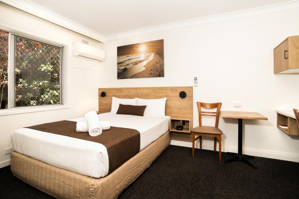 Postel nebo postele na pokoji v ubytování Caribbean Motel
