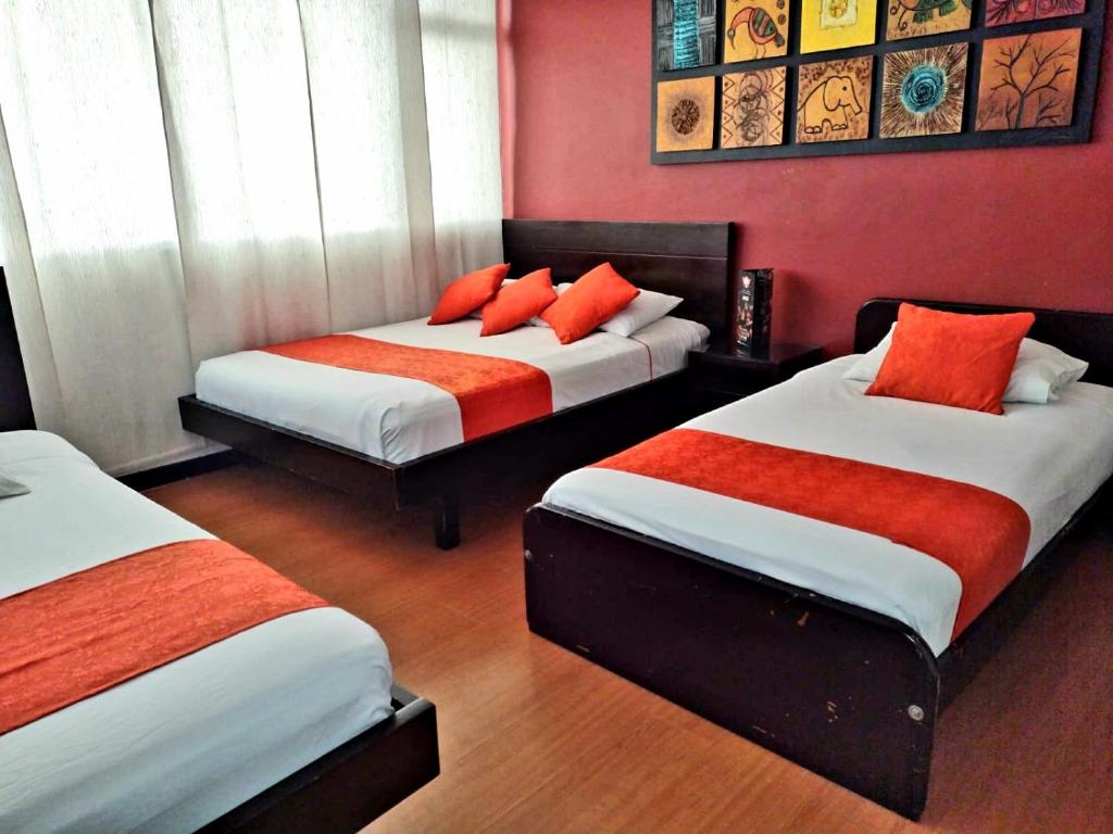 Postel nebo postele na pokoji v ubytování Hotel Fidenzi Bogotá