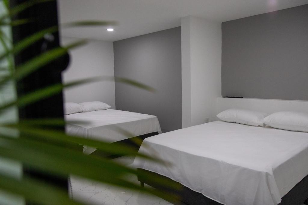 Postel nebo postele na pokoji v ubytování Nómada Hospedaje