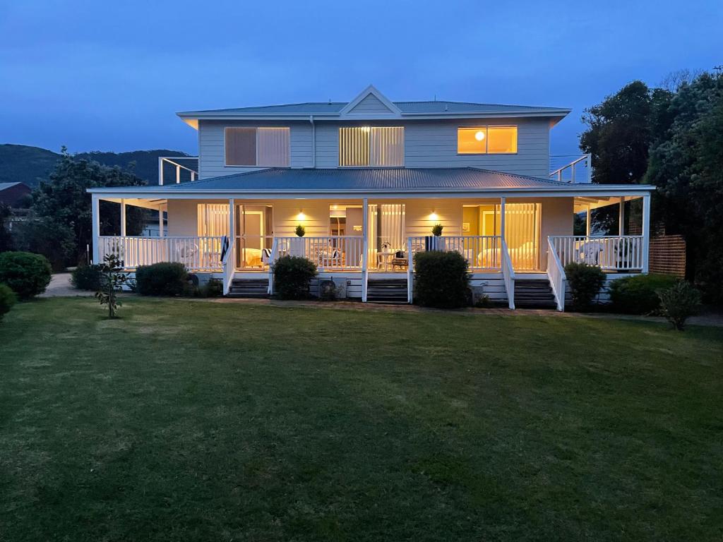 a large house with a lawn in front of it at Skippers Apollo Bay in Apollo Bay