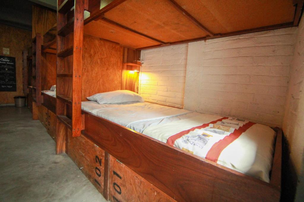 Postel nebo postele na pokoji v ubytování Canova Hostel & Pizza