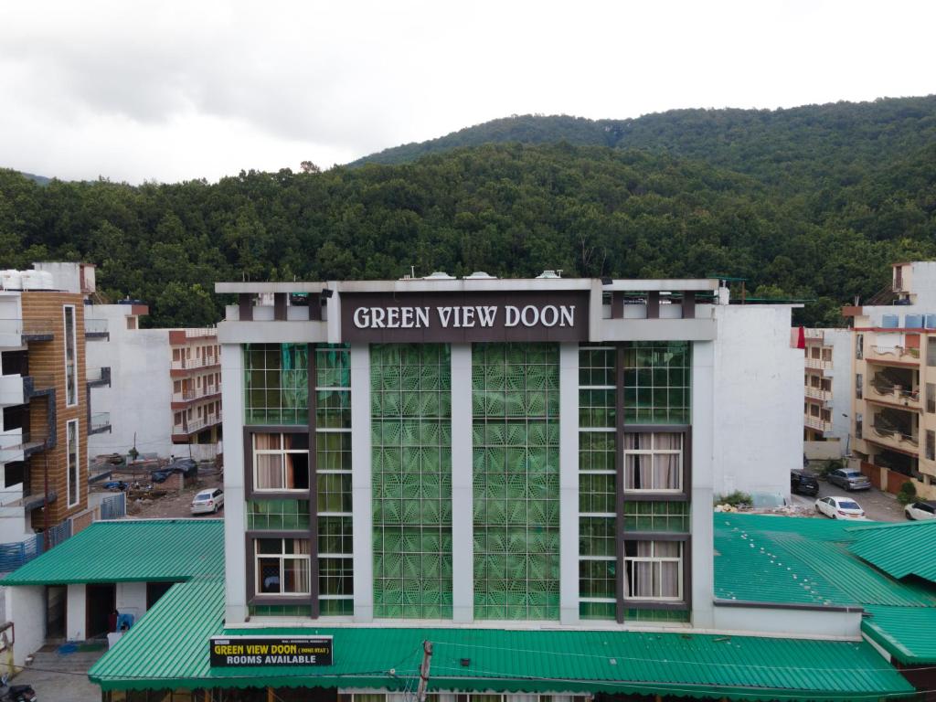 a building with a green view room sign on it at Home Stay Green View Doon in Dehradun