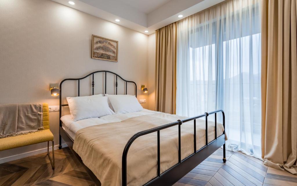 Postel nebo postele na pokoji v ubytování New Gudauri Neo Apartment 306