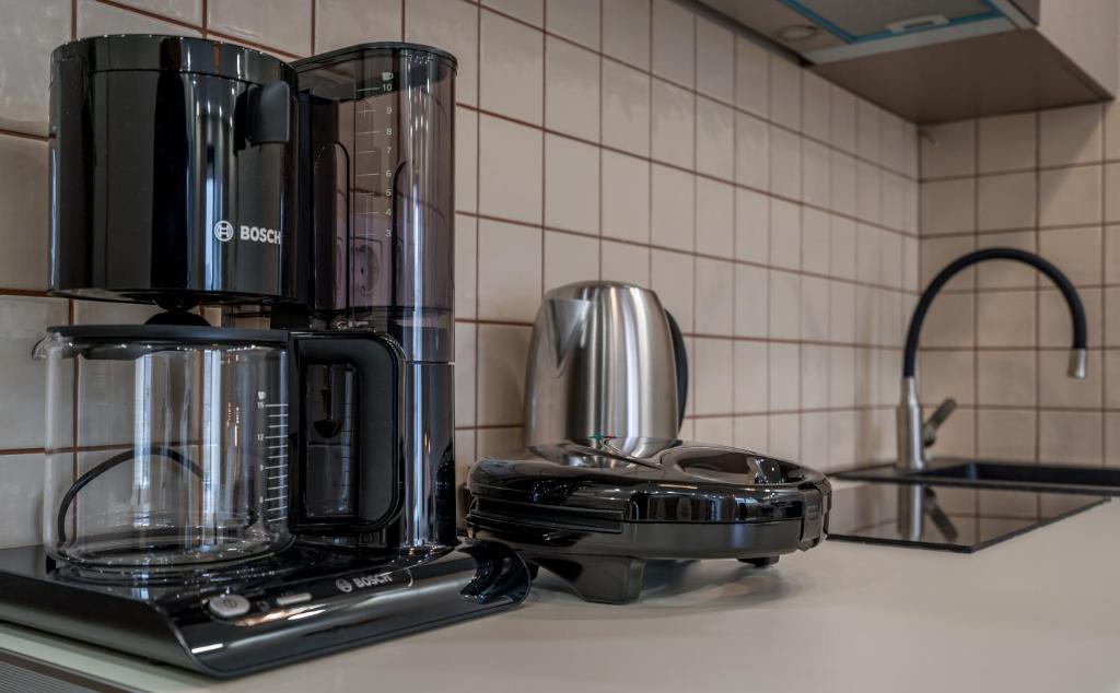 Kuchyň nebo kuchyňský kout v ubytování New Gudauri Neo Apartment 306