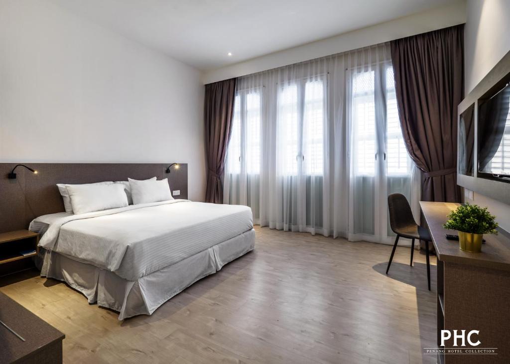 Letto o letti in una camera di Hutton Central Hotel Managed by The Ascott Limited