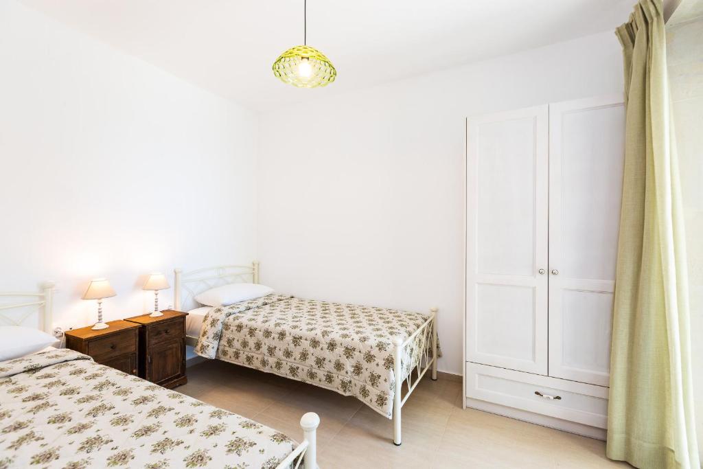 Postel nebo postele na pokoji v ubytování Villa Stone Thromila