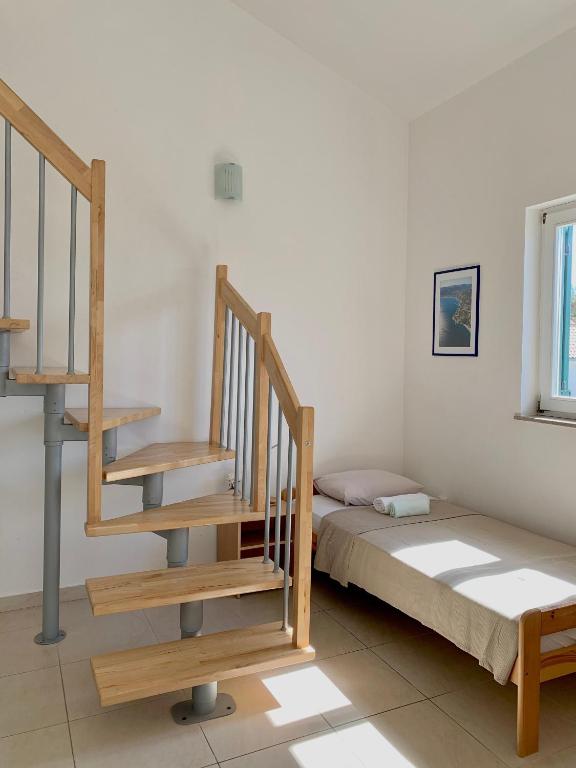 Łóżko lub łóżka w pokoju w obiekcie Apartments Happy Stay Center Baska